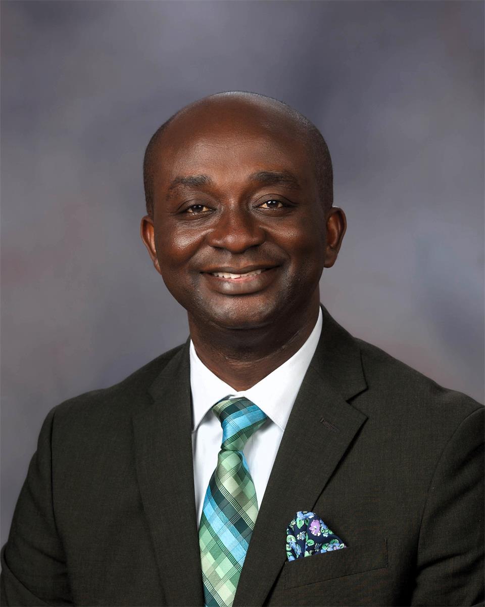 headshot of Oheneba Boadum in suit